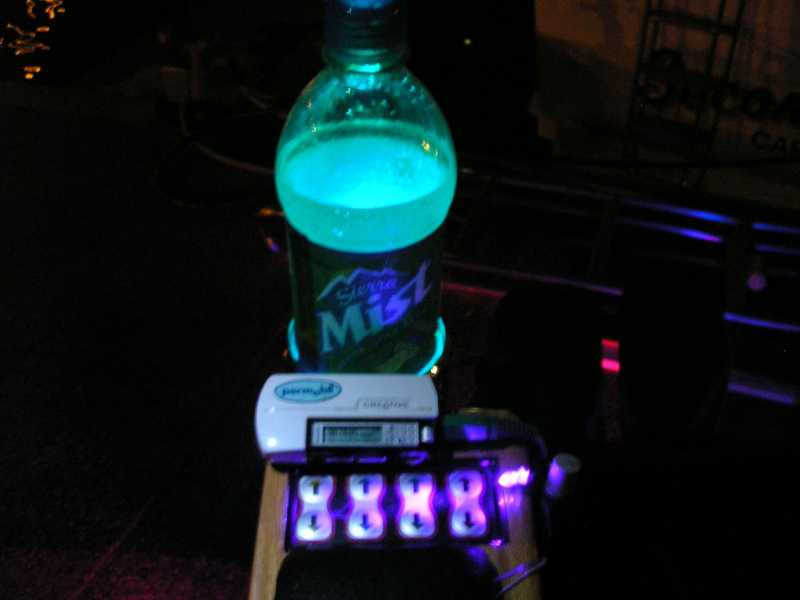 Seat controls and cupholder