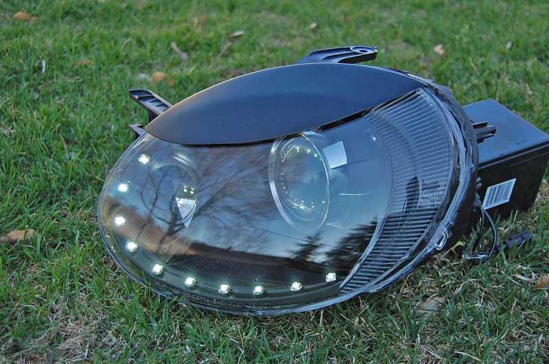 Custom headlight retrofit for my SRT-4 using 11 white superflux LEDs for the Audi R8 mod.