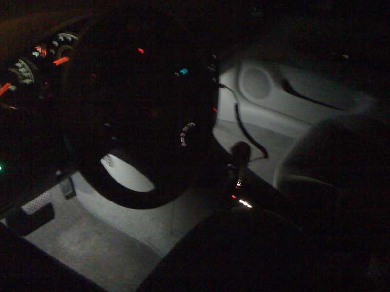 Pre-wired surface mount LED, cool white.  (1) in each foot well.