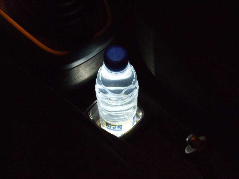 Cupholder Opel Agila. Prewired surface mount white Led. Night driving makes my face glow in the dark... I look like a ghost from outside car.