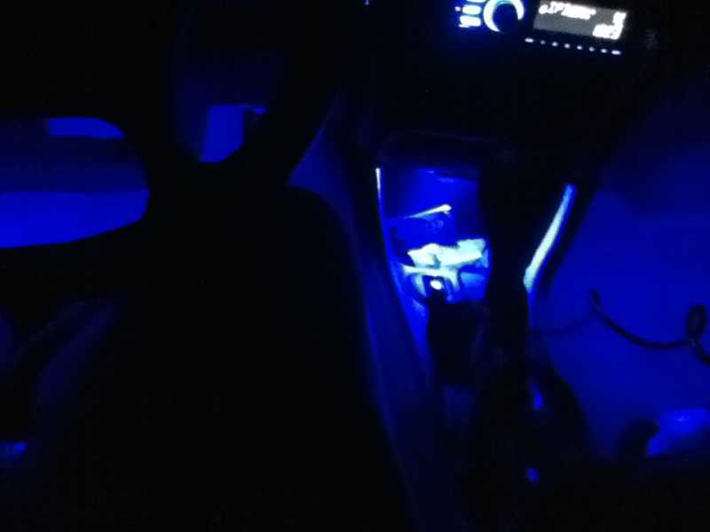 1 blue prewired surface mount L.E.D. in each footwell and the center cubby