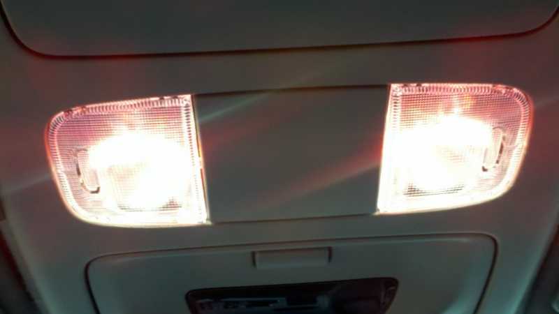 My map lights are plug-and-play SMT 194 bulbs in red to avoid losing night vision.  This picture shows them on with the Oznium SMT 3 chip superwhite LEDs stuck to the reflector.  2011 "Taco"ma