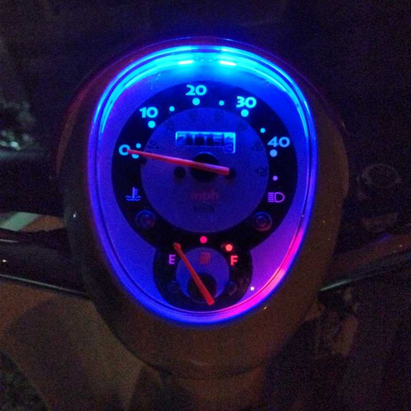 Two Prewired Superflux 4 Chip LEDs in the speedometer, one red another blue.